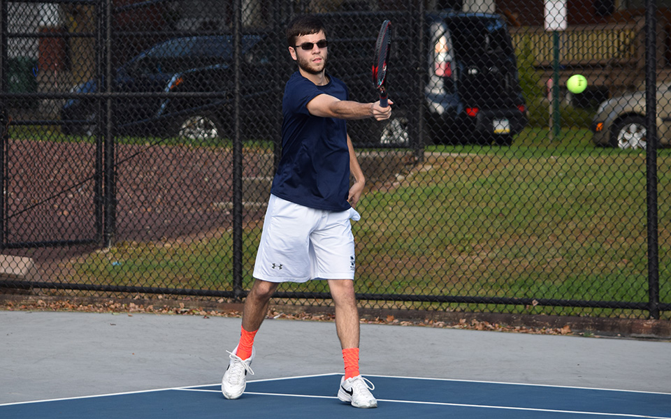 Sophomore Sean Kearns returns a shot in a match versus FDU-Florham on Hoffman Courts during the fall 2018 season.