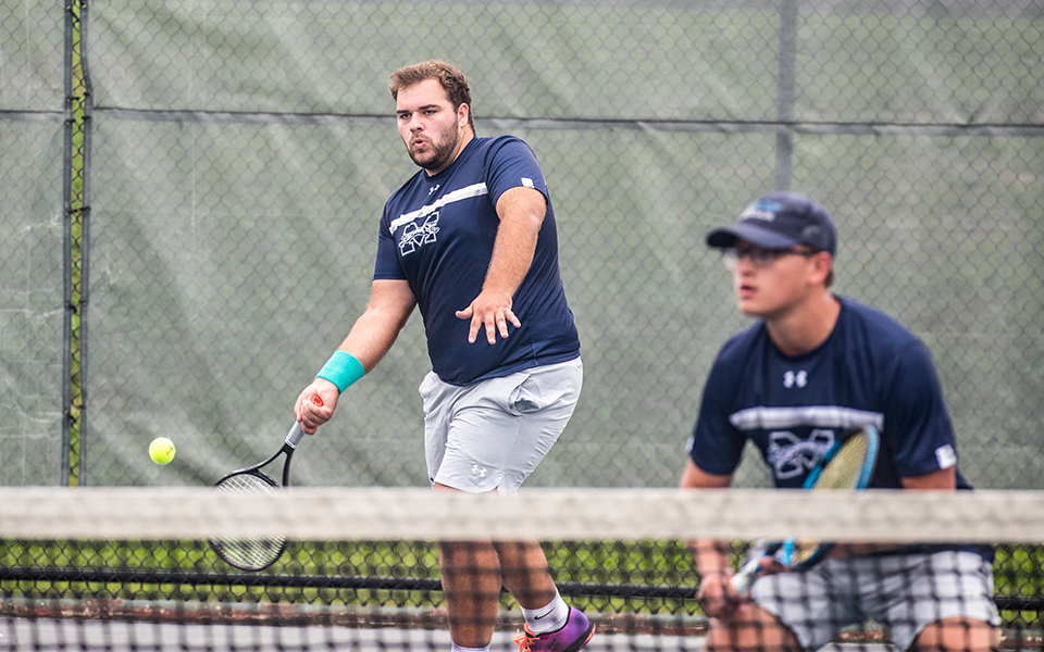 Senior Kieran Pisani returns a shot in doubles action versus DeSales University at Hoffman Courts during the fall portion of the season. Photo by Cosmic Fox Media / Matthew Levine '11
