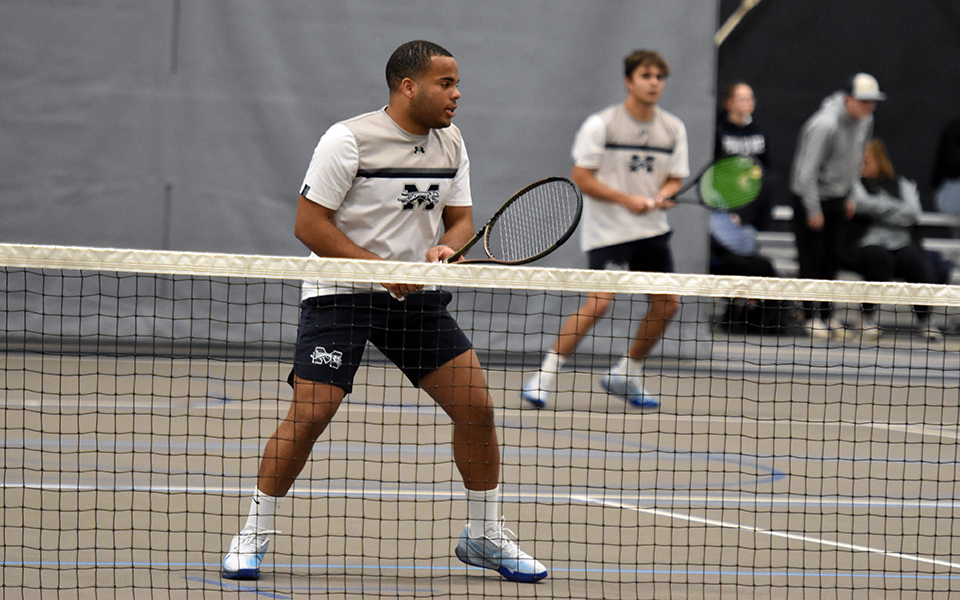 Sophomores Ronny Pimentel Ferrer and Wyatt Marshall await a serve in doubles action versus NCAA Division II Kutztown University of Pennsylvania in Timothy Breidegam Fieldhouse. Photo by Christine Fox