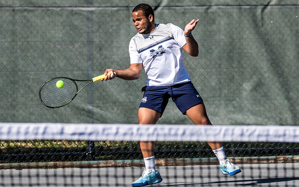 Sophomore Ronny Pimentel Ferrer hits a forehand during singles action versus Goucher College at Hoffman Courts. Photo by Cosmic Fox Media / Matthew Levine '11