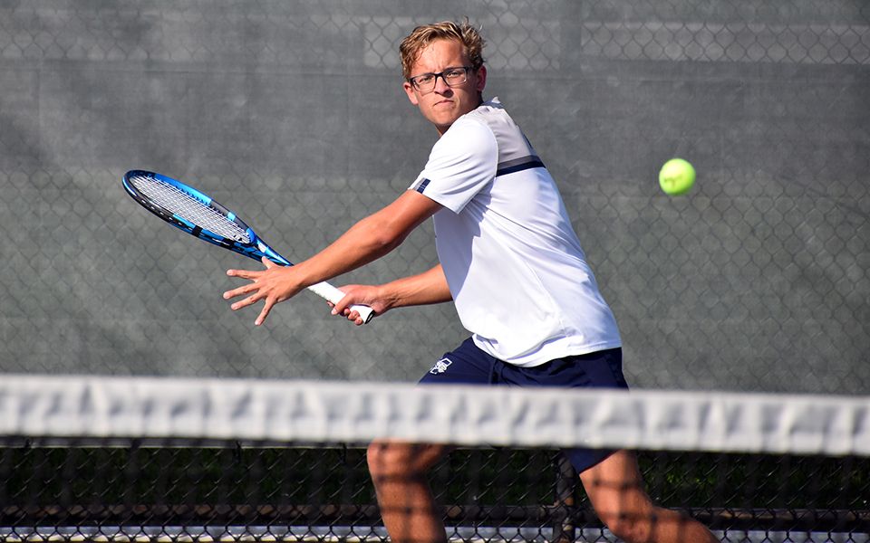 Sophomore Matthew Labosky returns a shot in doubles action versus Muhlenberg College at Hoffman Courts. Photo by Christine Fox