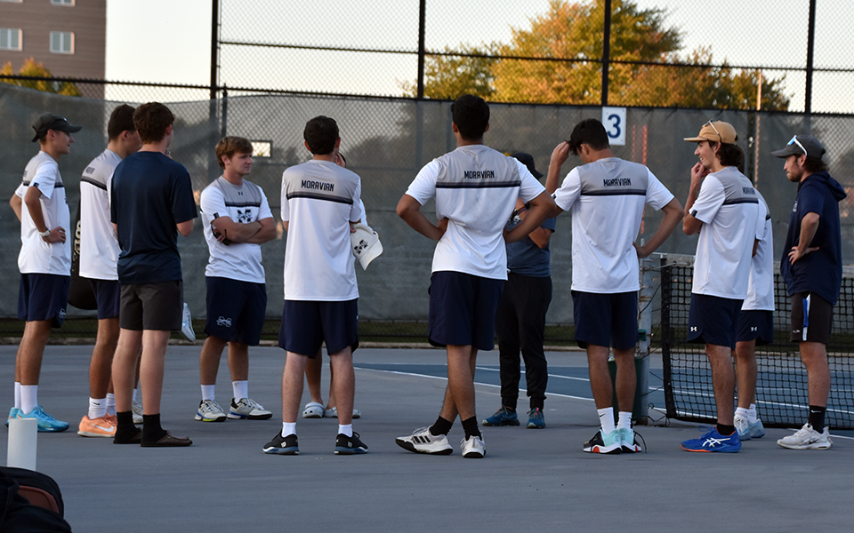 The Hounds talk after a match with Muhlenberg College at Hoffman Courts this season. Photo by Christine Fox