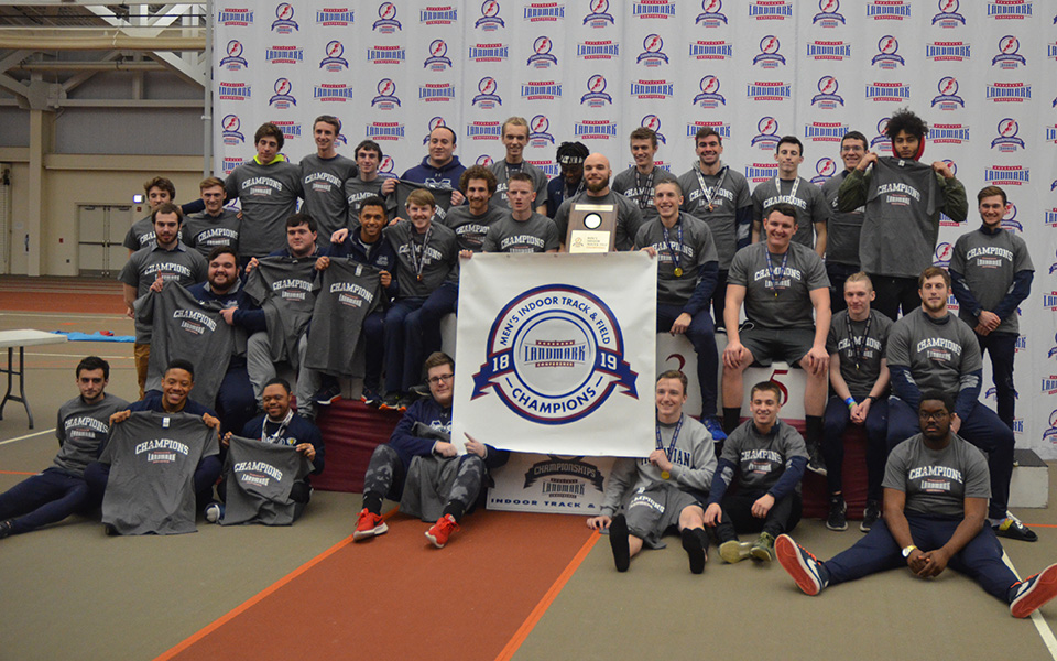The Hounds on the podium at Susquehanna University after capturing the 2019 Landmark Conference Championship.