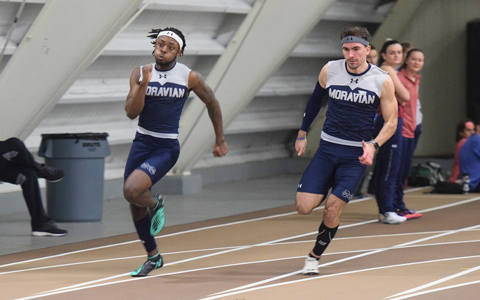 Sophomore Taylor Porter McPherson and junior Sean McFarland come off of a turn in the 200-meter dash during the Moravian Indoor Meet at Lehigh university's Rauch Fieldhouse.