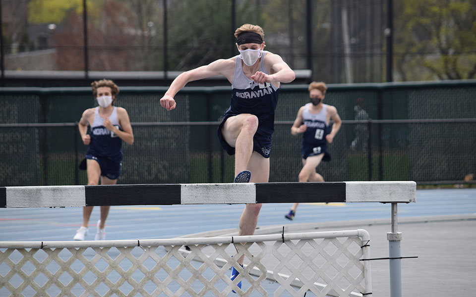Graduate student Greg Jaindl '20 heads over the water jump in the 3,000-meter steeplechase during the Greyhound Invitational on April 10, 2021 at Timothy Breidegam Track.