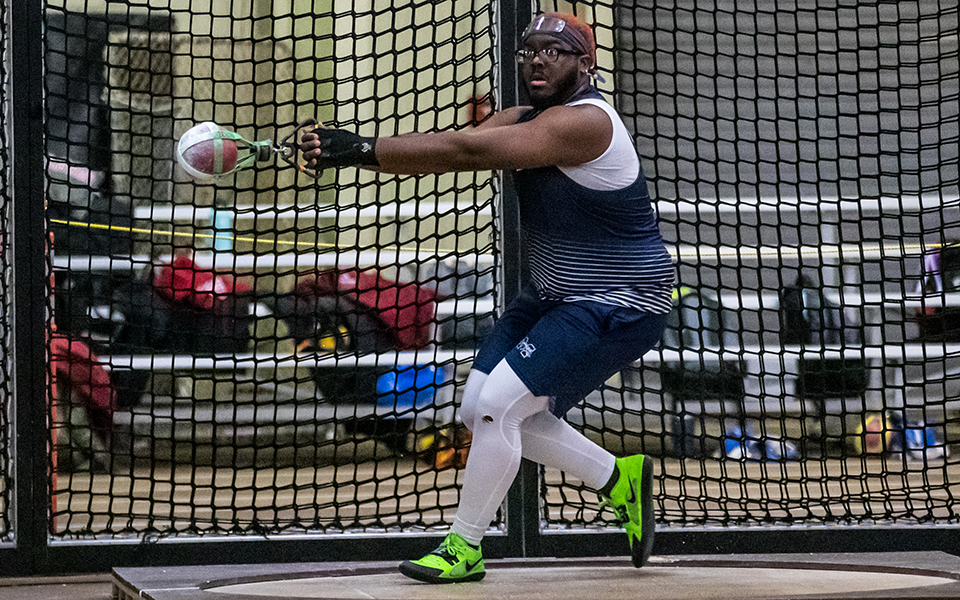 Graduate student Timothy King competes in the 25-pound weight throw during the 2022 Moravian Indoor Meet at Lehigh University's Rauch Fieldhouse. Photo by Cosmic Fox Media / Matthew Levine '11