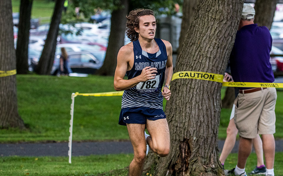 Shane Houghton runs the course at the 2021 Moravian Invitational at Bicentennial Park. Photo by Cosmic Fox Media / Matthew Levine '11.