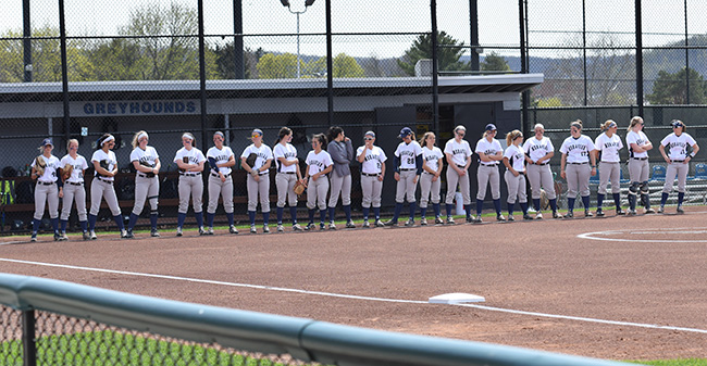 The Greyhounds await the starting line-up prior to a game during the 2017 season.
