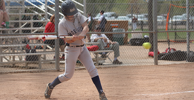 Kaela Kane '19 connects on a pitch versus the College of St. Benedict (Minn.) in Arizona early in the 2018 season.