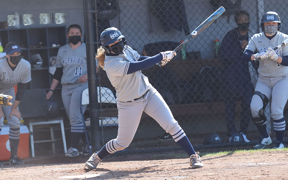 Alexis Agrapides '23 hits a single through the right side versus Juniata College at Blue & Grey Field on March 20.