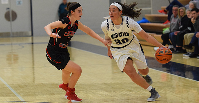 Camille McPherson '18 looks to drive to the basket versus Catholic University.
