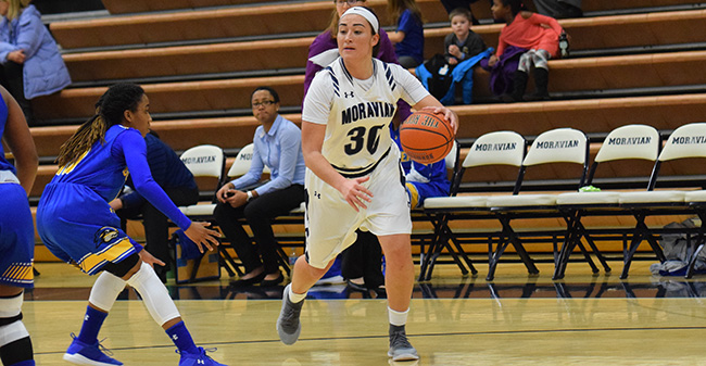 Camille McPherson '17 looks to drive to the basket in a game against Goucher College.