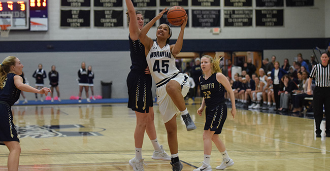 Nadine Ewald '20 drives to the basket in a game versus Juniata College.