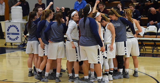 The Greyhounds huddle before their final home game of the 2017-18 season versus Juniata College.