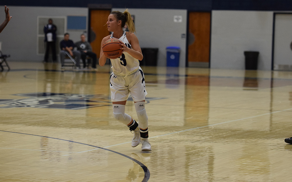 Maddie Capuano heads up court in a game versus Penn State Lehigh Valley in Johnston Hall.