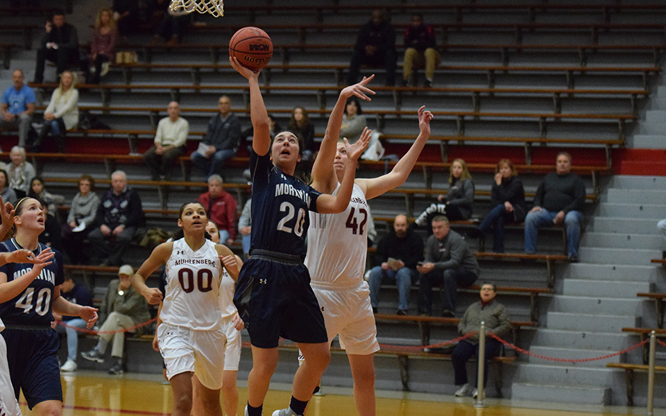 Senior Caitlin Flanagan drives to the basket for a lay-up at Muhlenberg College.
