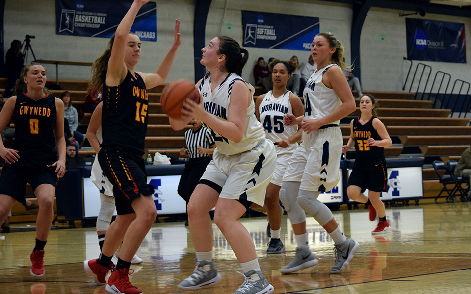 Sophomore Jennifer McClave goes up for a lay-up versus Gwynedd Mercy University in Johnston Hall.