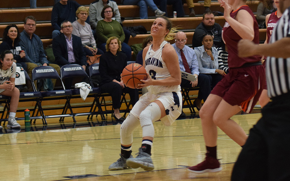 Junior guard Maddie Capuano goes up for a lay-up in the second half versus Susquehanna University in Johnston Hall.