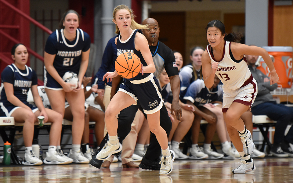 Junior guard Mikayla Anderson dribbles up the floor during the first half at Muhlenberg College. Photo by Christine Fox