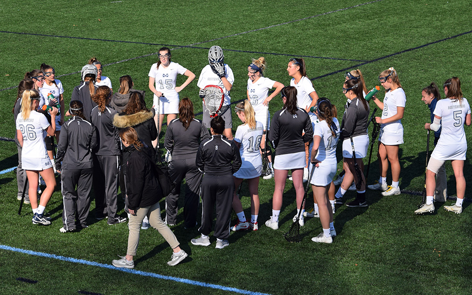 The Greyhounds talk during a timeout in a match versus Elizabethtown College on John Makuvek Field during the 2018 season.