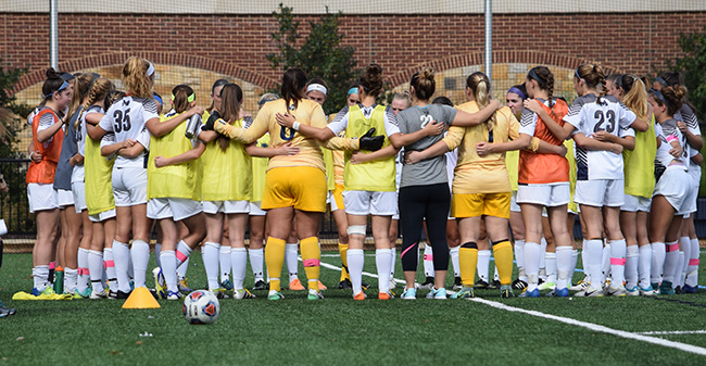 The Greyhounds prepare for the second half of a Landmark Conference match versus Goucher College.