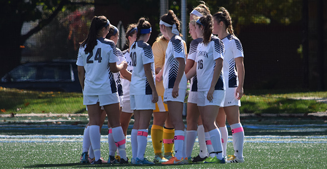 The Greyhounds prepare for a match versus Goucher College earlier this season.