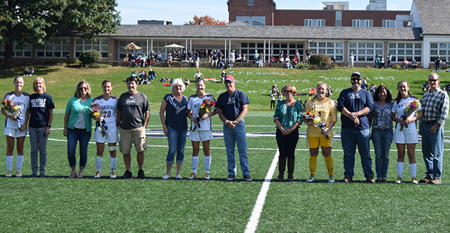 Lauren Bertucci '18, Catherine Condly '18, Emily Crowley '18, Jessica Lawton '18 and Maria Manz '18 with their parents on Senior Day prior to the start of a match versus Juniata College.