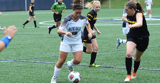 Juliana Caranci '20 moves the ball down the sideline in a match against Bryn Mawr College.