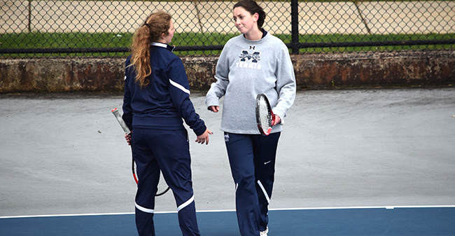 Emma Angle '21 and Kate Rennar '19 talk strategy during a doubles match versus Ursinus College at Hoffman Courts.