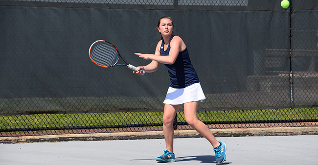 Mary Angle '21 returns a shot during doubles action versus Catholic University of America in a Landmark Conference Semifinal match at Hoffman Courts.