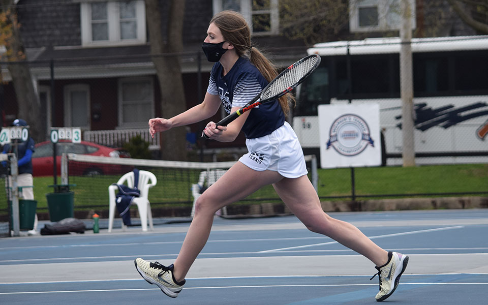 Kristen Cassidy '21 returns a shot in singles action against Juniata College at Hoffman Courts on April 17.