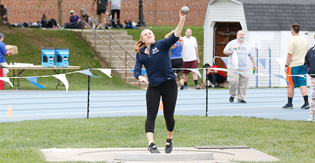 Trista Cunningham '18 competes in the shot put, one of her two event wins, on the opening day of the 2018 Landmark Conference Outdoor Championships. Photo courtesy of Elizabethtown College Athletic Communications.