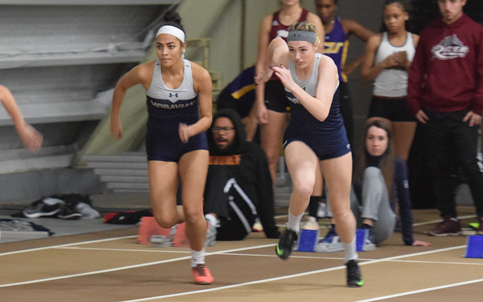 Tatiana Lopez (left) and Aimee Badman come out of the blocks in the 60-meter dash at Lehigh University's Rauch Fieldhouse during the 2017-18 season.