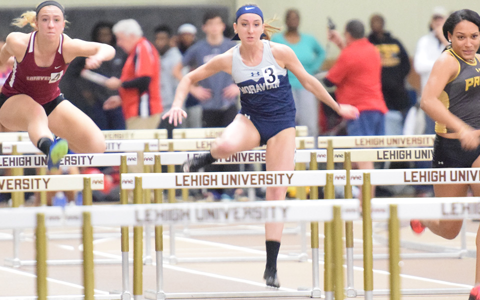 Senior Anna Osman runs a hurdle race during the Leigh University Fast Times Before Finals at Rauch Fieldhouse in December.