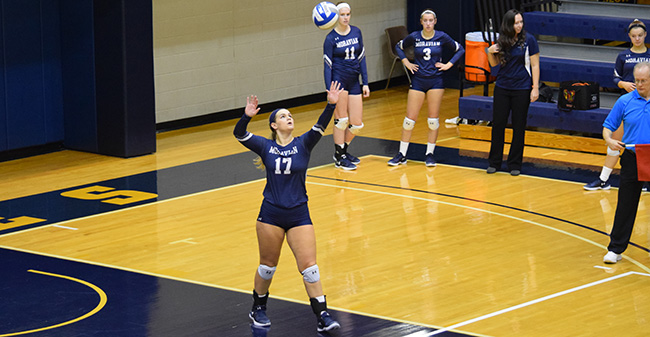 Mary Zacher '18 serves up the ball during a Landmark Conference Semifinal match at No. 22 Juniata College.