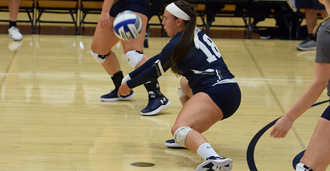 Jean Markovic '18 digs a ball against York College of Pennsylvania.
