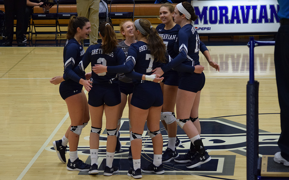 The Greyhounds celebrate a point in a win over Keystone College in Johnston Hall.