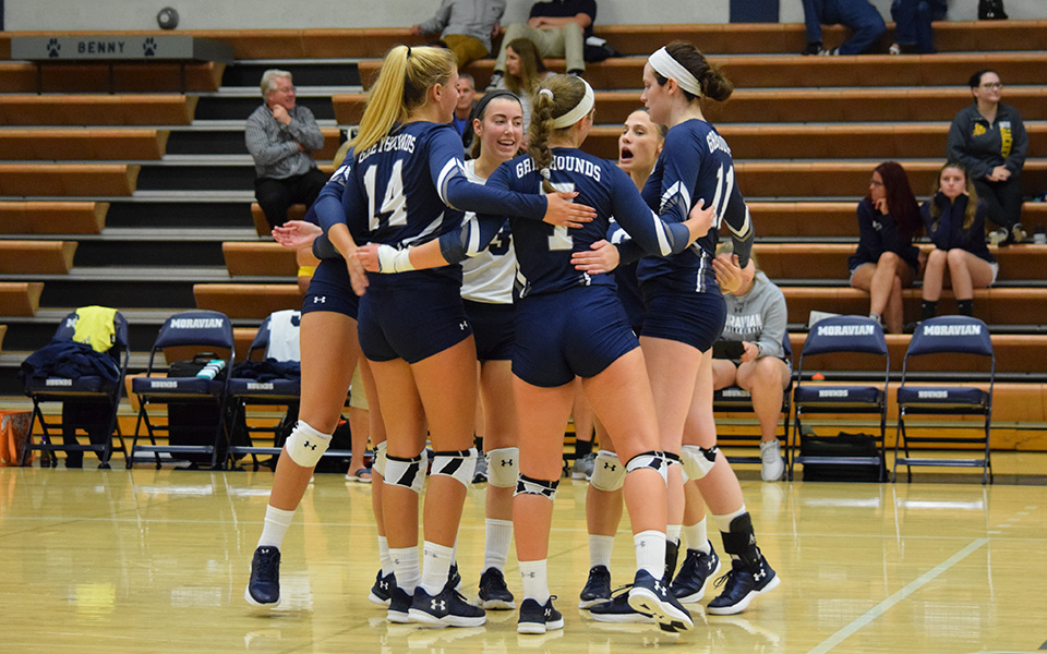 The Greyhounds celebrate a point in the 2018 season opener versus Baldwin-Wallace (Ohio) University.
