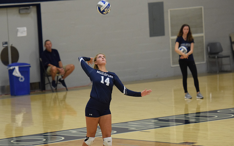 Freshman Sela Herber serves in a match versus Franklin & Marshall College in Johnston Hall.