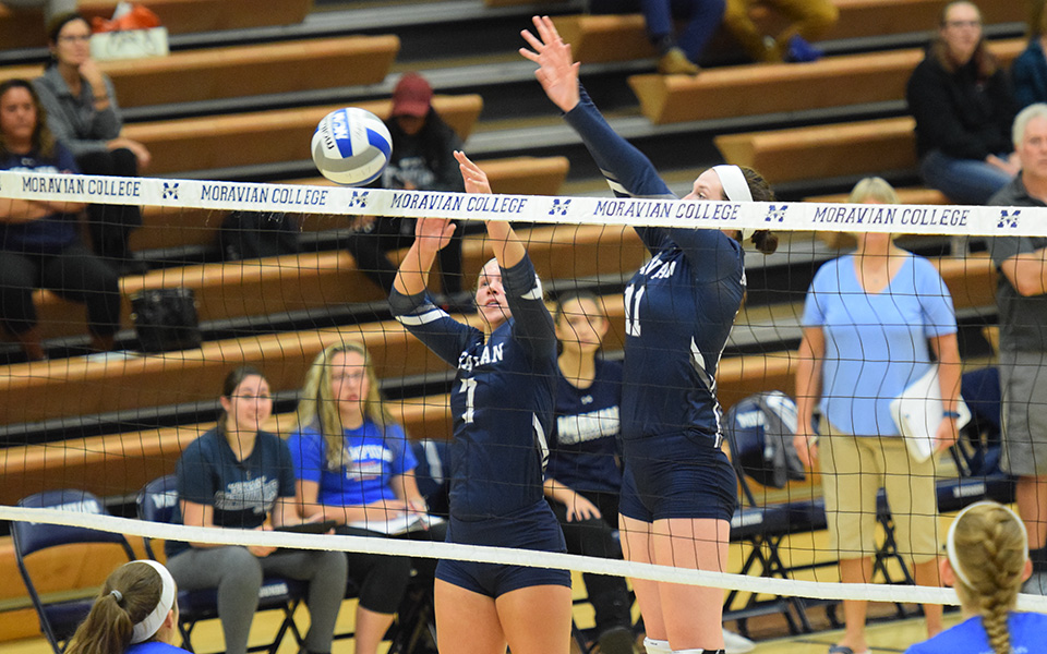 Junior Victoria Kauffman and senior Erin Tiger go up for a block versus Franklin & Marshall College.