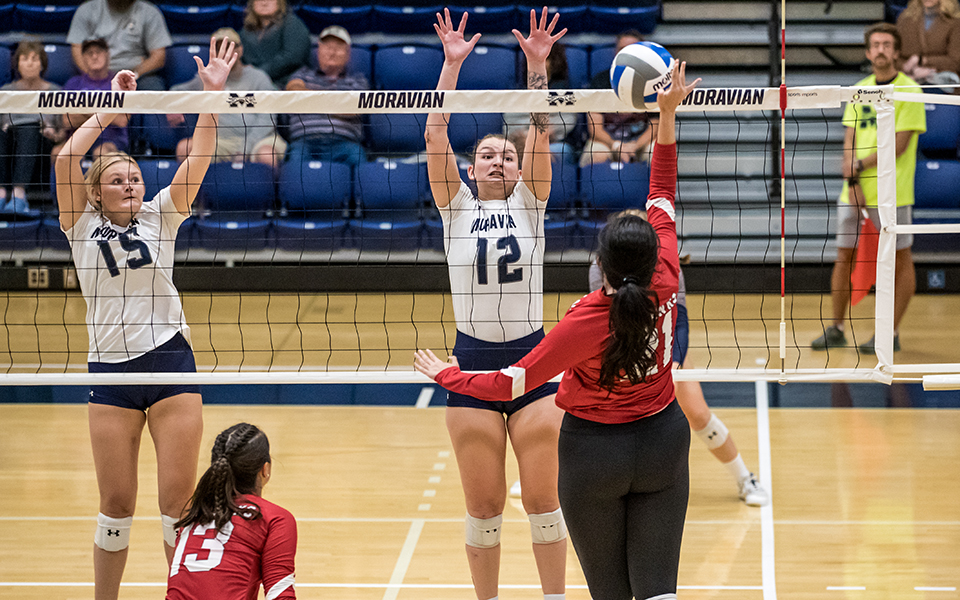 Freshman Payton Reuber and graduate student Kat Wilt go up for a block in a match versus Montclair State University in Johnston Hall during the 20th Greyhound Premiere Invitational. Photo by Cosmic Fox Media / Matthew Levine '11