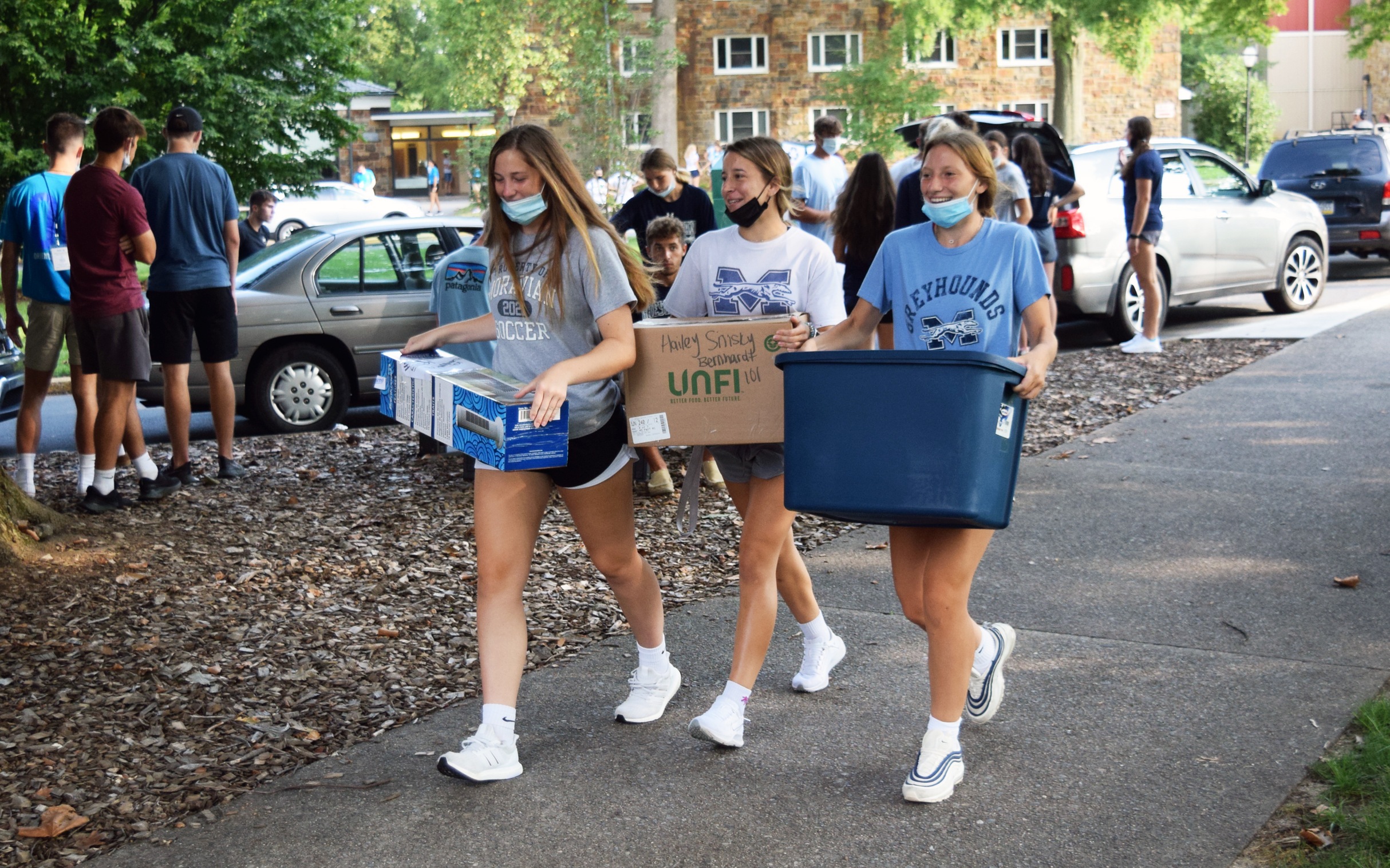 Members of the Moravian University women's soccer team help during move in for the Class of 2025.