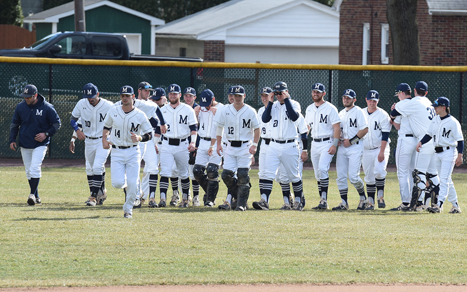 The Greyhounds head in from left field after a final meeting before hosting New Jersey City University at Gillespie Field during the 2019 season.