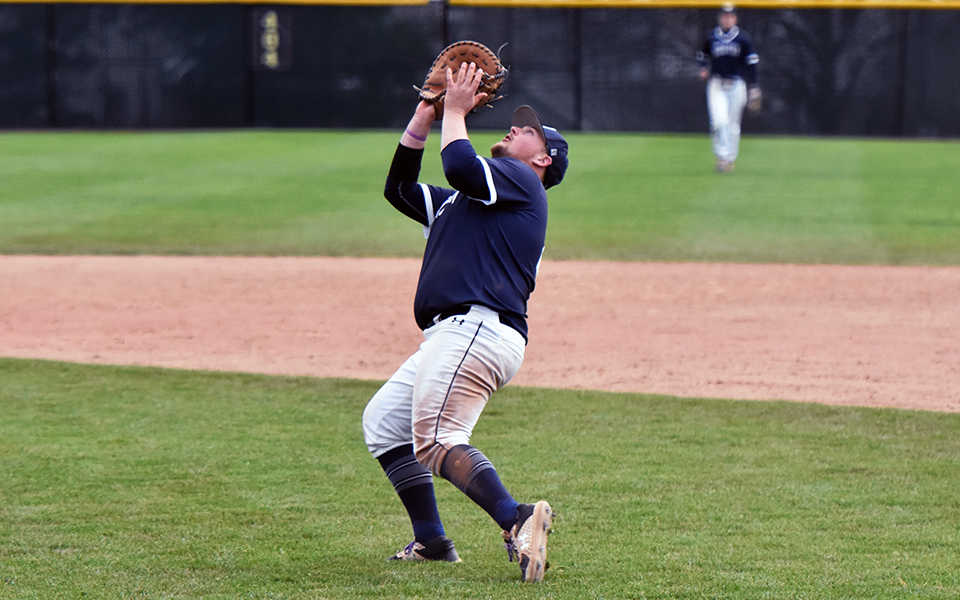 Graduate student Brett Moyer catches a pop fly in the infield at Gillespie Field versus Catholic.