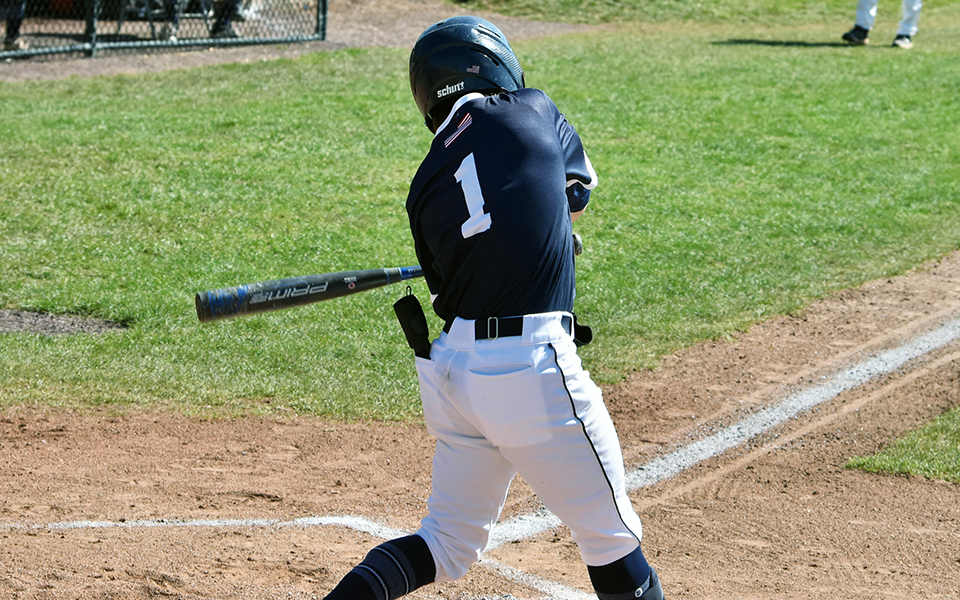 Senior Robert Roman takes a swing at a pitch in non-conference action against Albright College at Gillespie Field.