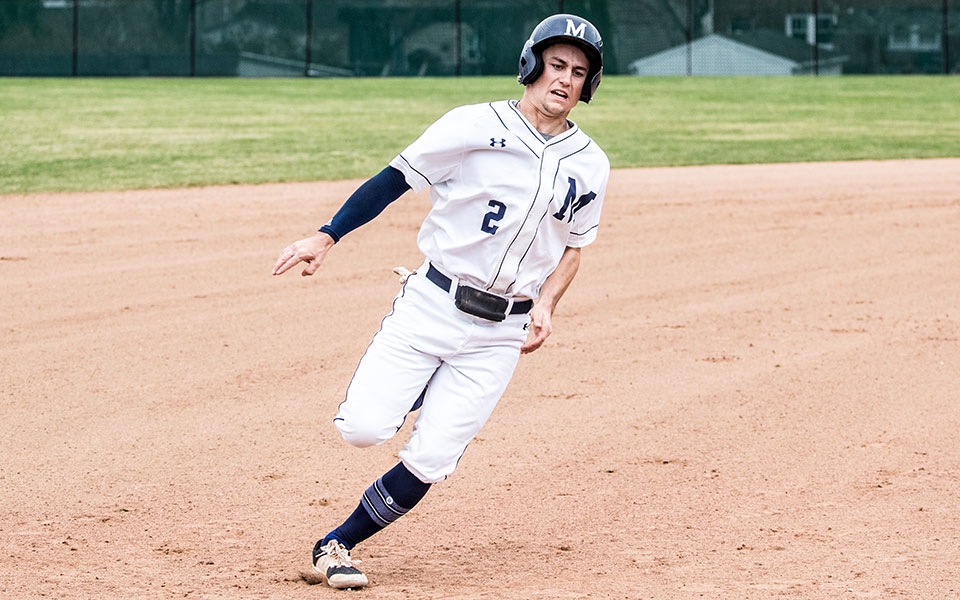 Junior Mason Fisher rounds third base in a game versus Juniata College at Gillespie Field in March 2022. Photo by Cosmic Fox Media / Matthew Levine '11