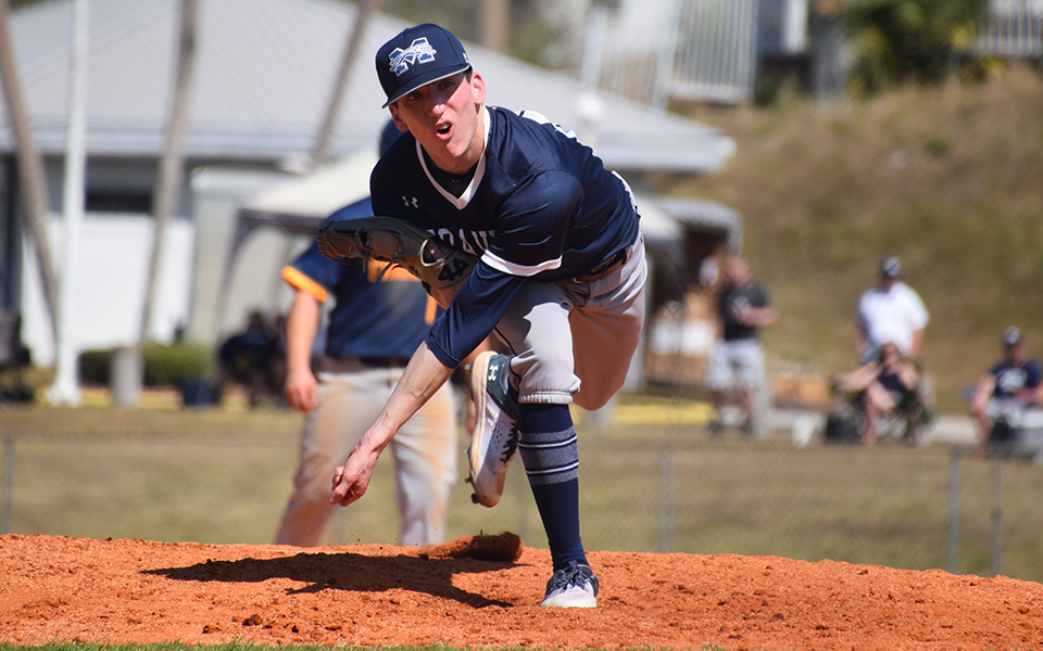 Sophomore Chris Medei follows through on a pitch versus Franklin (Ind.) College during the RussMatt Central Florida Invitational. Photo by Christine Fox