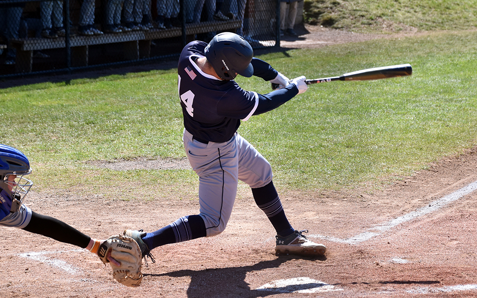 Sophomore outfielder Nick Henry hits an RBI single in the first inning versus Elizabethtown College at Gillespie Field. Photo by Marissa Williams '26