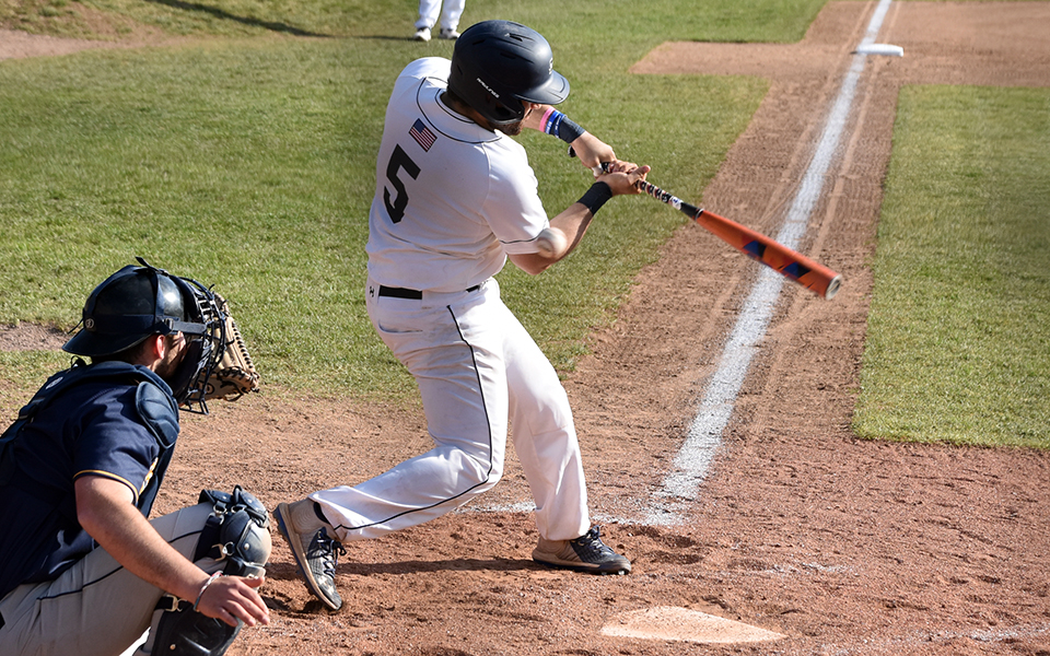 Freshman James Ruban III swings during a game versus Neumann University at Gillespie Field earlier this season. Photo by Grace Nelson '26
