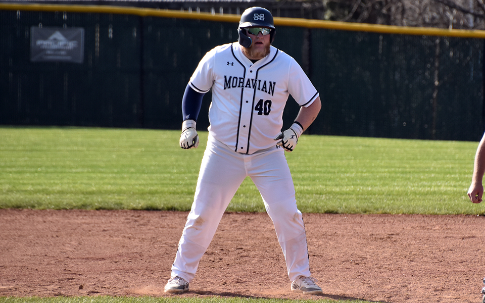 Senior first baseman leads away from first base after a hit versus Penn State Brandywine at Gillespie Field. Photo by Marissa Williams '26